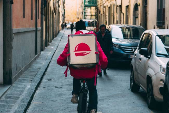 A boy delivering food